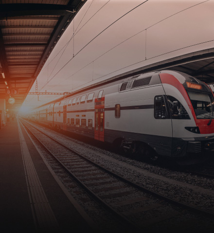 Long train standing on train station.